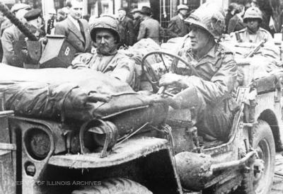 Allied soldiers driving through Belgian city
