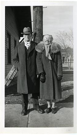 Unidentified older man and woman in formal clothes