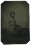 Clarke as a child with a drum