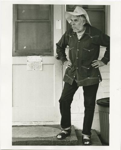 Harry Partch at the entrance to his home