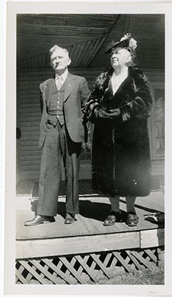 Unidentified man and woman in fur coat