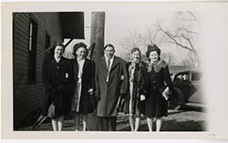 Anna Fay with a group, dressed formally